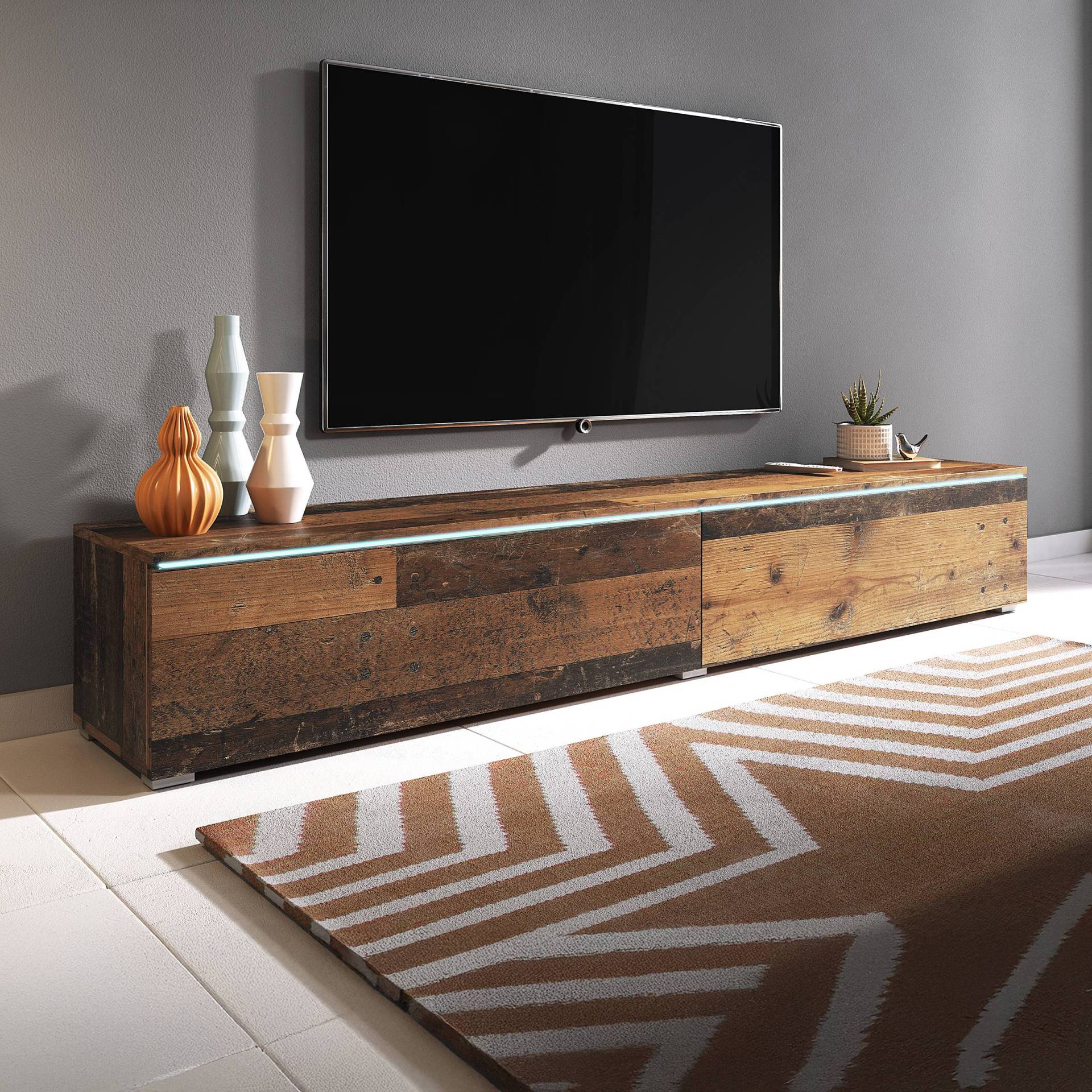 home24 Beleuchtetes TV-Lowboard Minnas - 180 cm Spanplatte, beschichtet Braun/Altholz Dekor 180 x 30 x 33cm home24 Beleuchtetes TV-Lowboard Minnas - 180 cm Spanplatte, beschichtet Braun/Altholz Dekor 180 x 30 x 33cm von home24