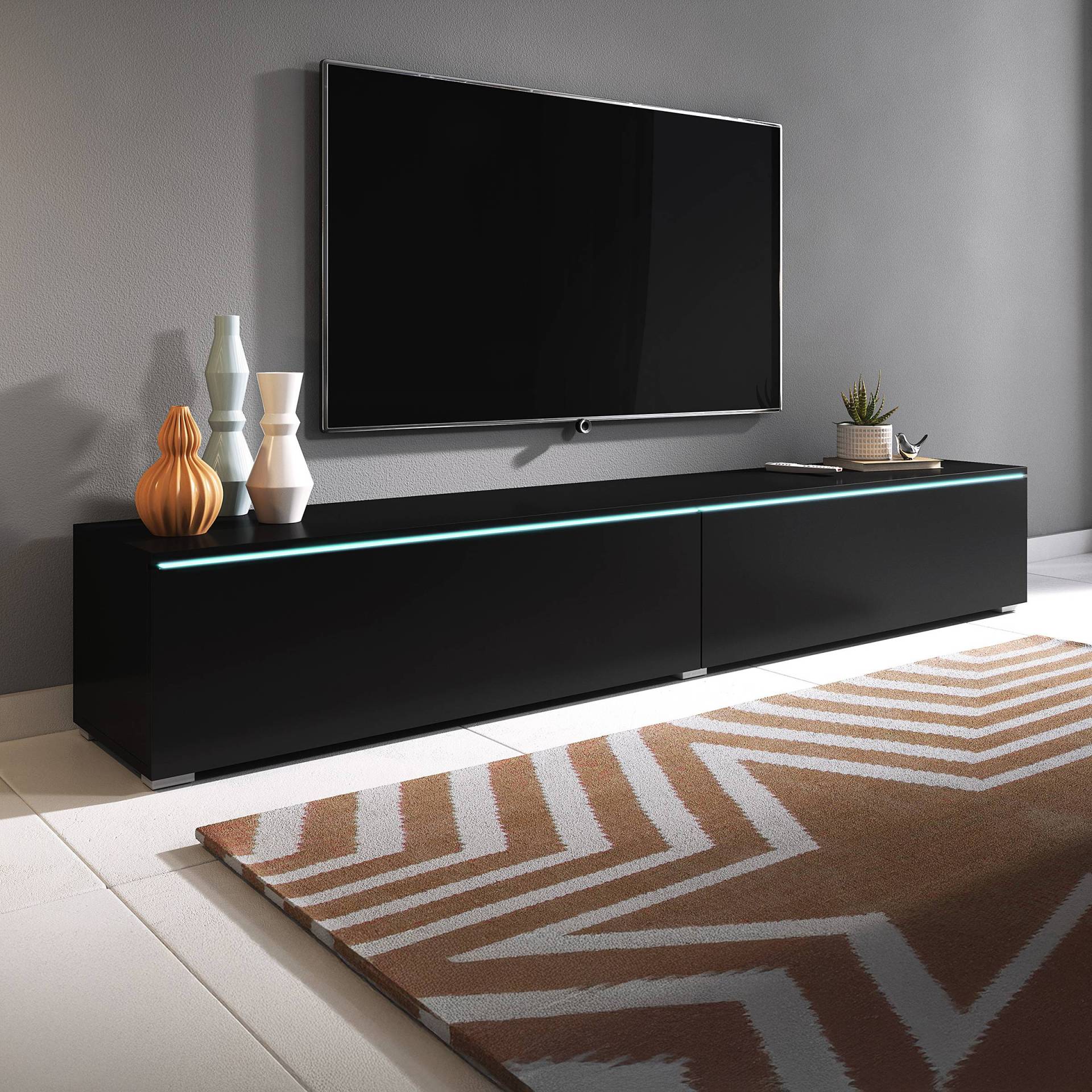 home24 Beleuchtetes TV-Lowboard Minnas - 180 cm Spanplatte, beschichtet Schwarz/Schwarz 180 x 30 x 33cm home24 Beleuchtetes TV-Lowboard Minnas - 180 cm Spanplatte, beschichtet Schwarz/Schwarz 180 x 30 x 33cm von home24