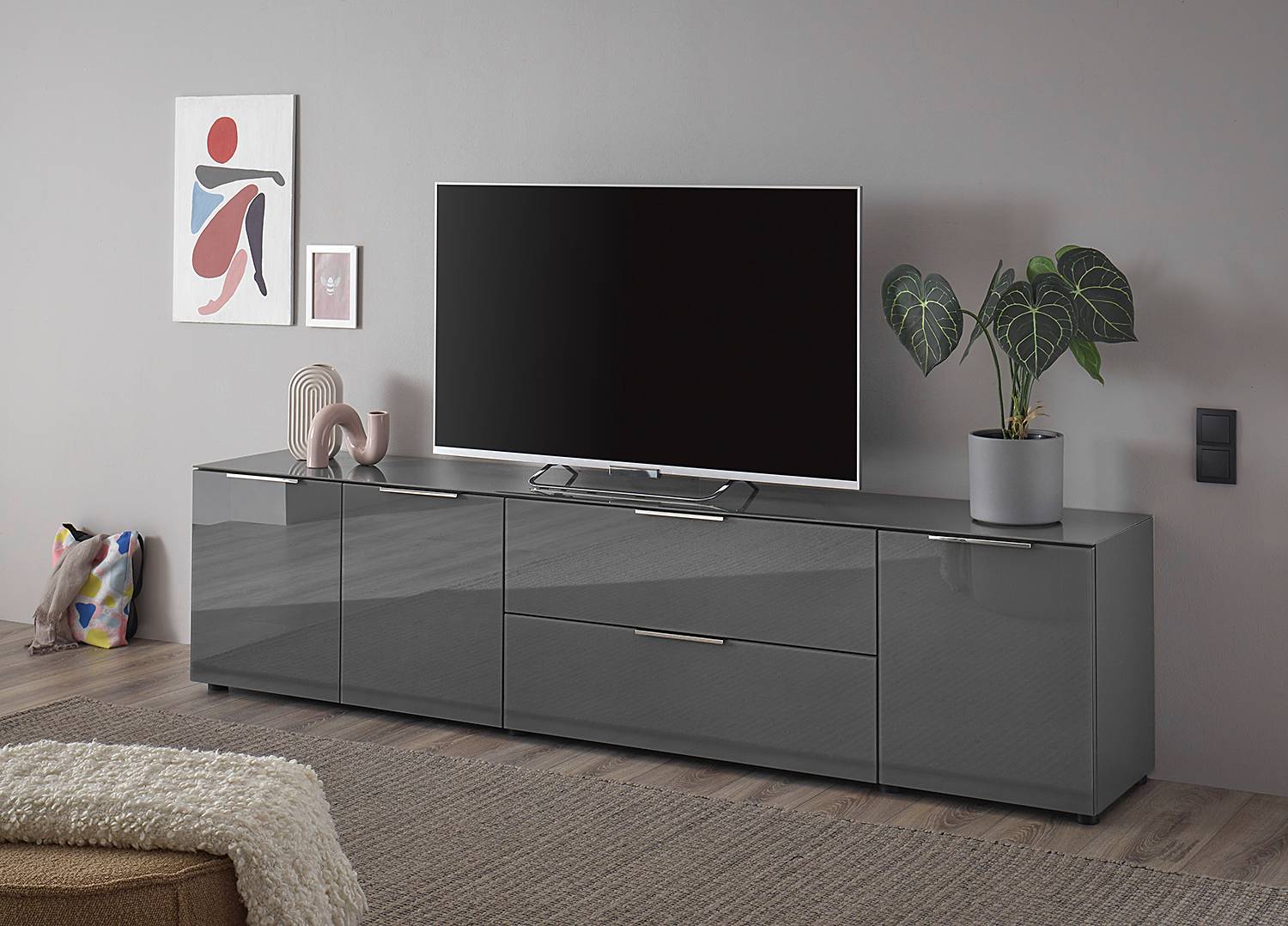 home24 TV-Lowboard Front & Deckplatte: Glas Korpus: Spanplatte, beschichtet Grau/Anthrazit 226cm home24 TV-Lowboard Front & Deckplatte: Glas Korpus: Spanplatte, beschichtet Grau/Anthrazit 226cm von home24